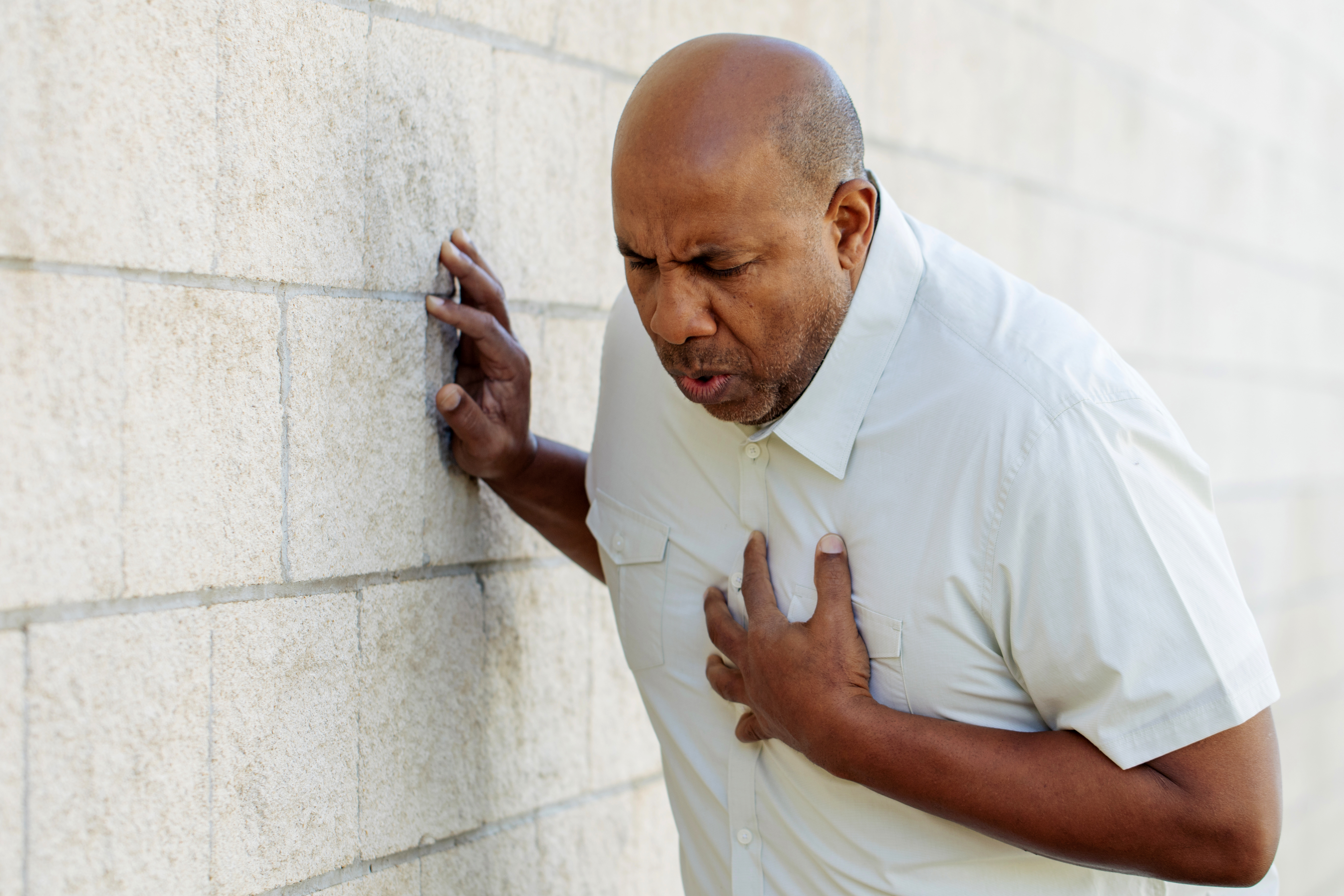 man-having-chest-pains